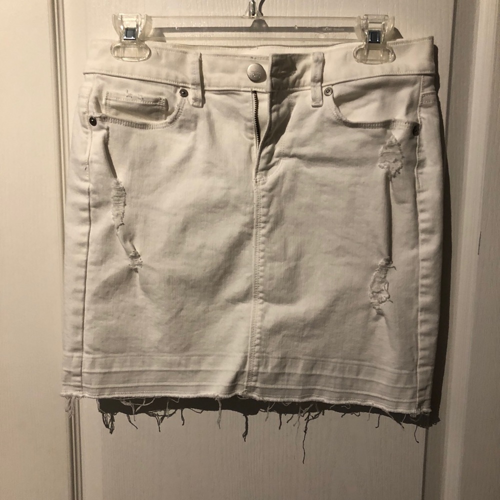 Distressed white jean skirt